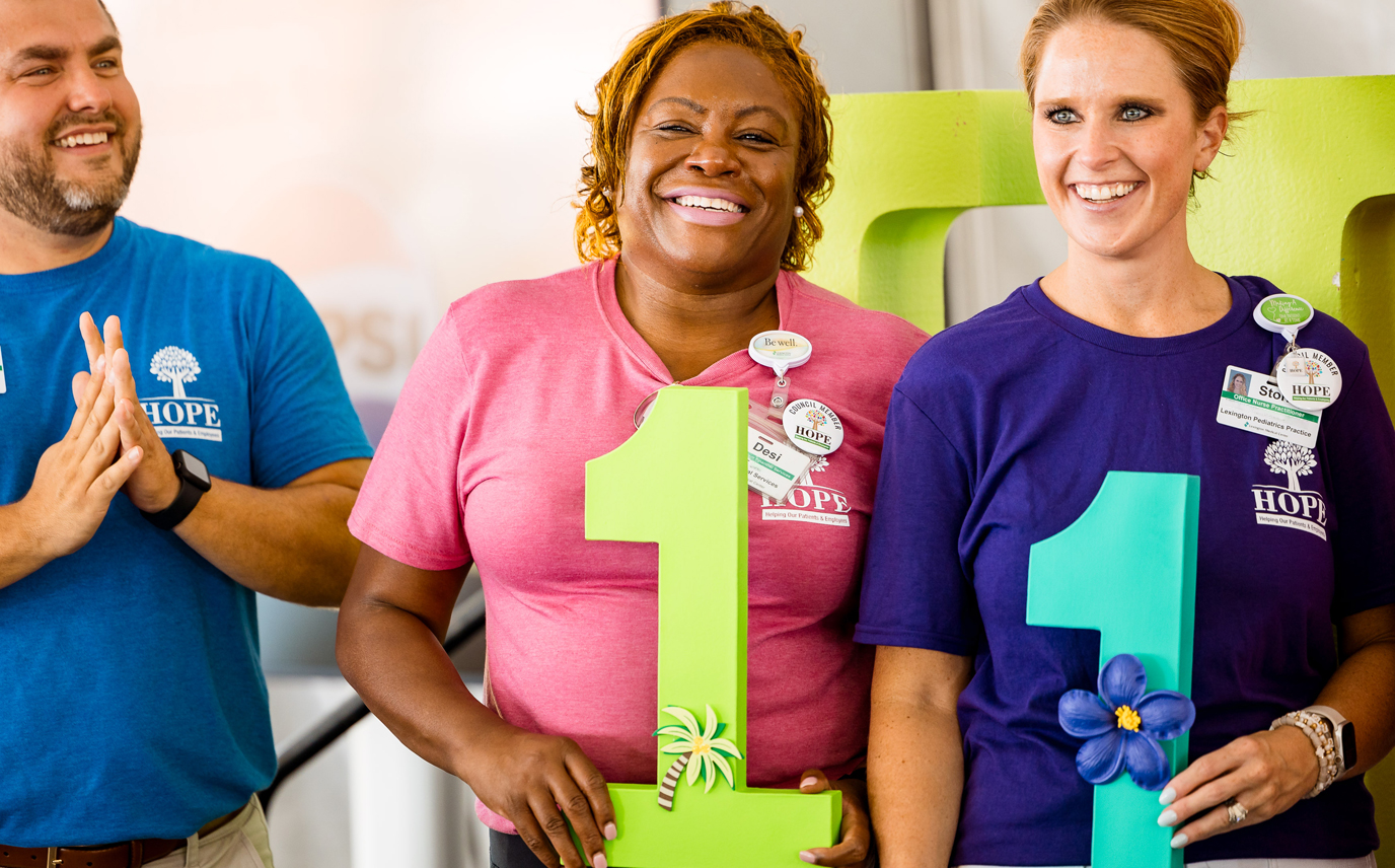 Smiling Lexington Health employees at a HOPE Employee Giving event. 